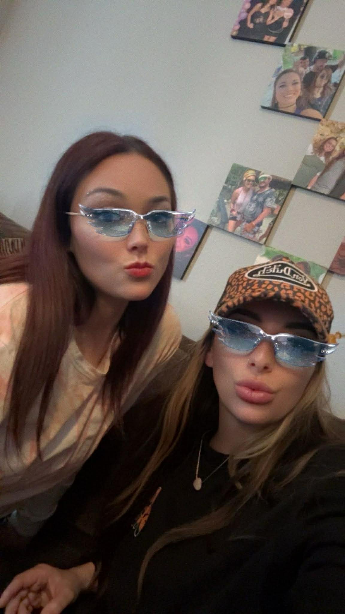 The Cushwell Girls — kissy faces in matching cat-eye sunglasses, the canonical color shot.